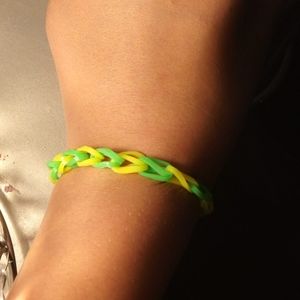 A green and yellow rubber band braclet